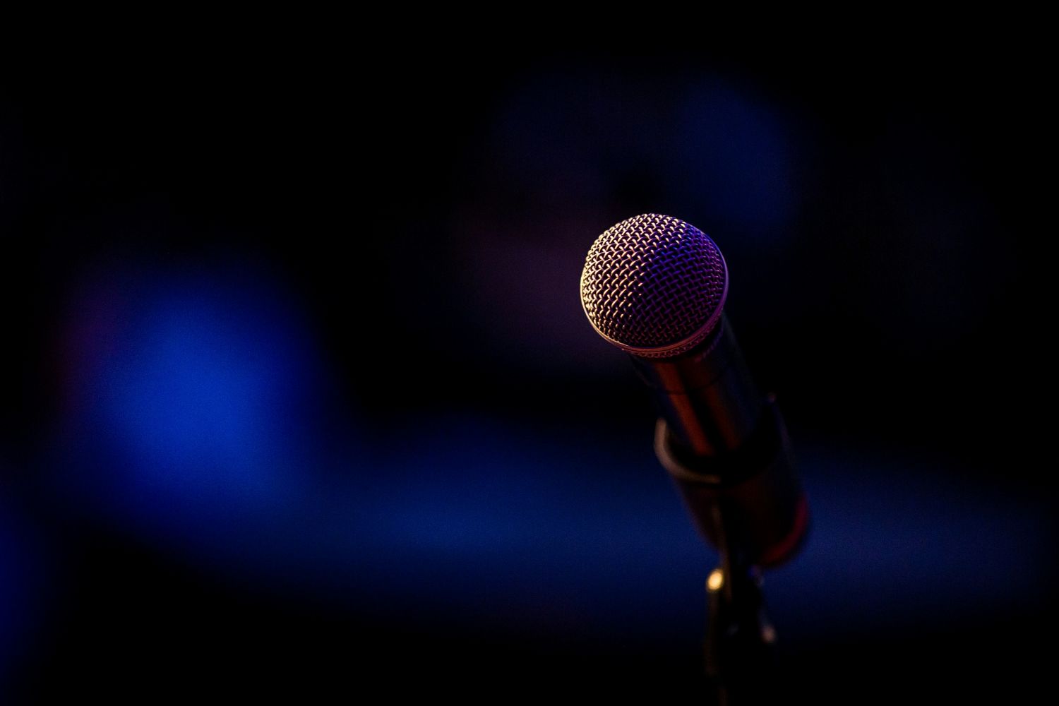 a photo of a microphone on a stage